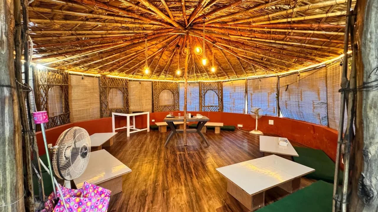 The bamboo practice hall on the Tapovan campus, hammocks hanging ready