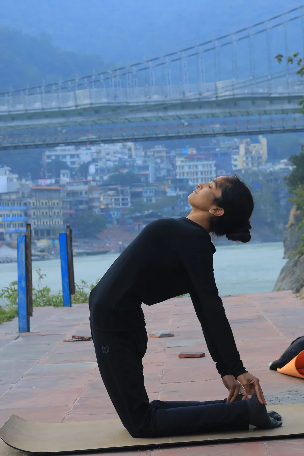 Camel pose on the steps near Ram Jhula